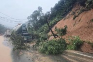 Landslide strikes bus on mountain pass  in Vietnam, killing 6, as heavy rain persists