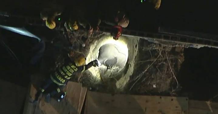 Police chase suspect falls down 30-foot hole at building site and is 'critical'