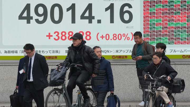 Global stocks rise after Wall Street surges on hopes for lower interest rates