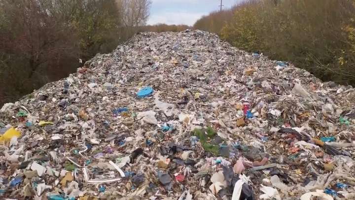 Mountain of illegally dumped trash near Oxford river causes outcry in England