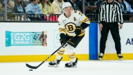Bruins' Charlie McAvoy exits after slap shot hits mouth
