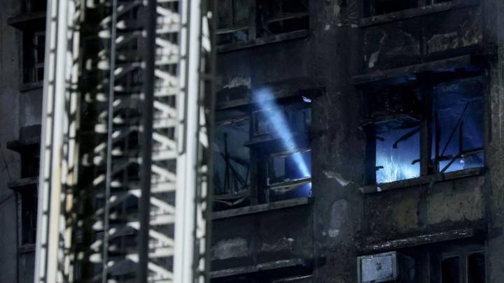 Rescuers pull survivor from Hong Kong blaze as death toll rises to 65