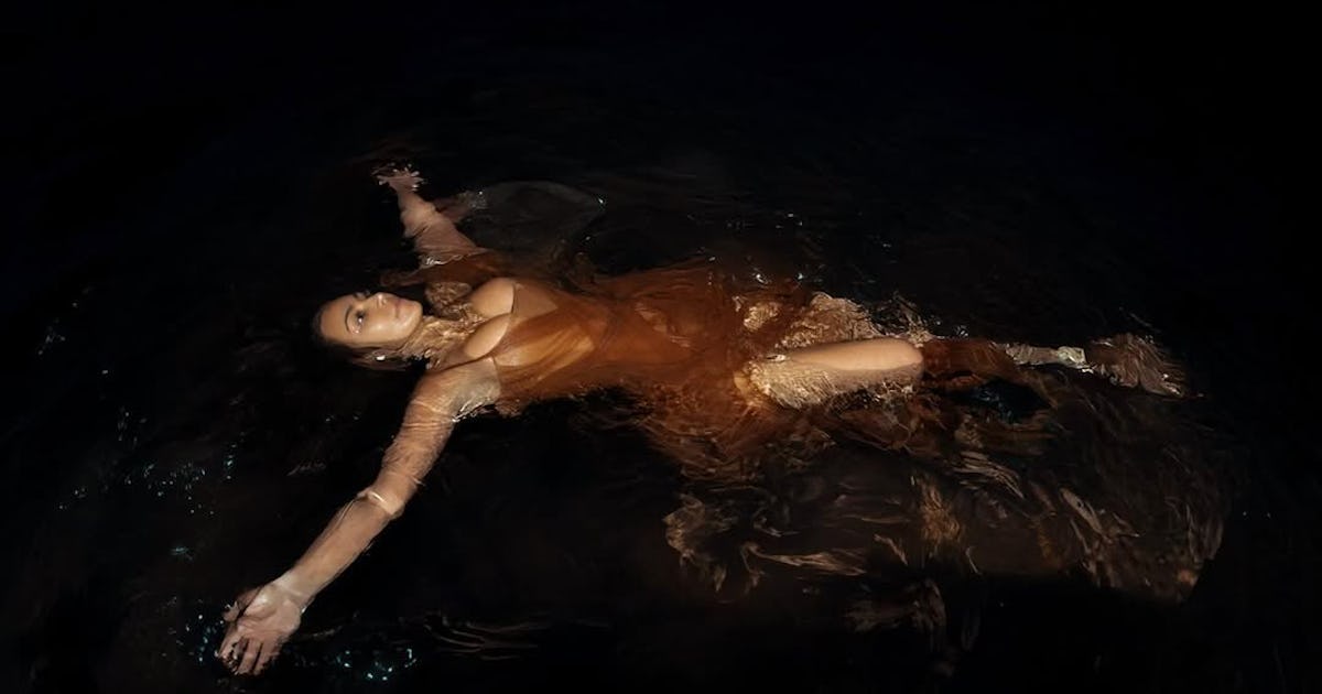 Kim Kardashian Wears a Museum-Worthy McQueen Dress to Go Swimming