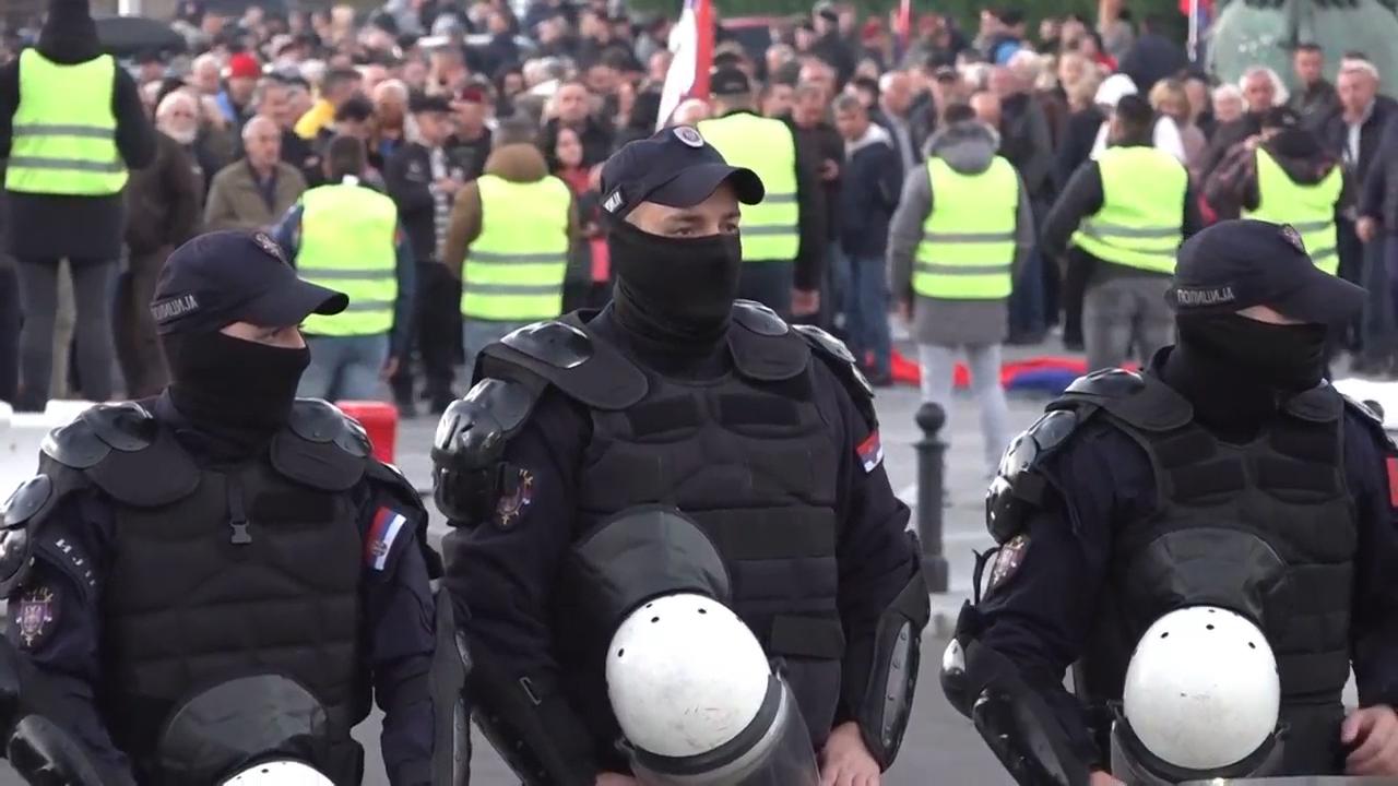 Serbian police face off with anti-government protesters outside parliament in Belgrade