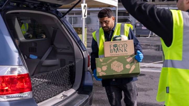 At some food banks, surging demand means a struggle to feed families