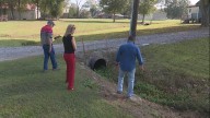 Neighbors want water directed elsewhere, cost to fix covered
