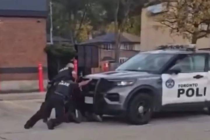 Officer and tasered suspect 'inadvertently' run over by Toronto police cruiser during chaotic arrest