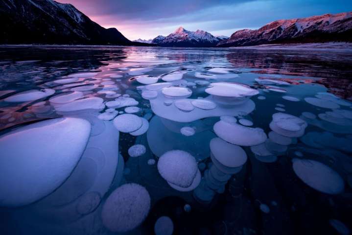 Ice bubbles at this huge Canadian lake are a must