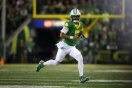 No. 7 Oregon routs Minnesota 42-13 with big night from Dante Moore