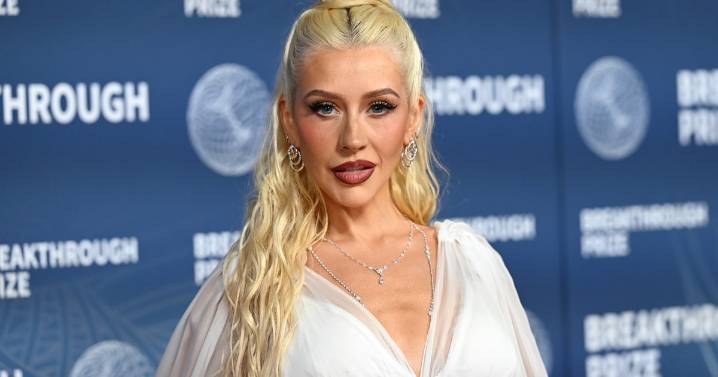 Christina Aguilera Wore A Cleavage-Baring Dress In 'Christmas In Paris'