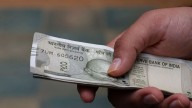Rupee opens lower at 88.66 as foreign fund outflows, strong dollar weigh