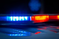 One dead in Madisonville fire, detective injured in crash after leaving scene