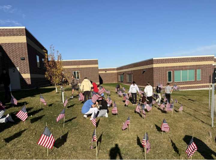 Mandan Middle School students plant flags in support of veterans