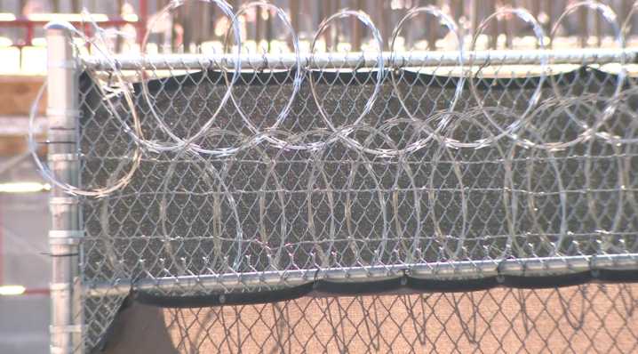 Neighbor reacts to arrests, officer involved shooting taking place on his street following child predator operation