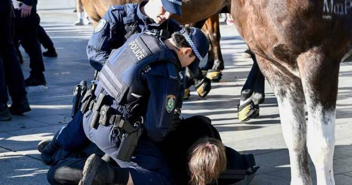 Chaos erupts with mass arrests at weapons expo protest