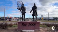 Sault Ste. Marie roundabout features statues of Chief Shingabawossin and French fur trader