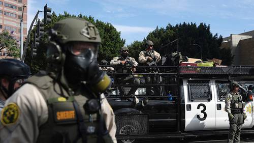 California sued by Trump administration for law banning masked federal agents