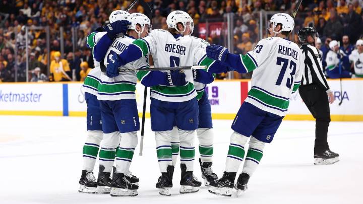Canucks recover in OT against Predators after blowing 2