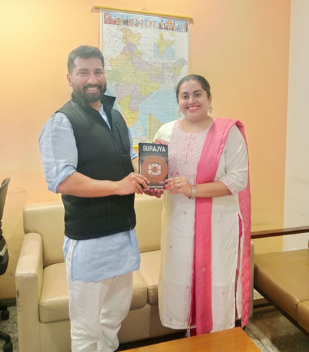 Author Reshel Bretny Fernandes presents her book Surajya to BJP national secretary Anil K Antony