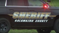 Man in custody after shooting at bond agents, barricading himself in Kalamazoo business