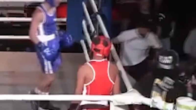 Boxer throws water bottle at referee