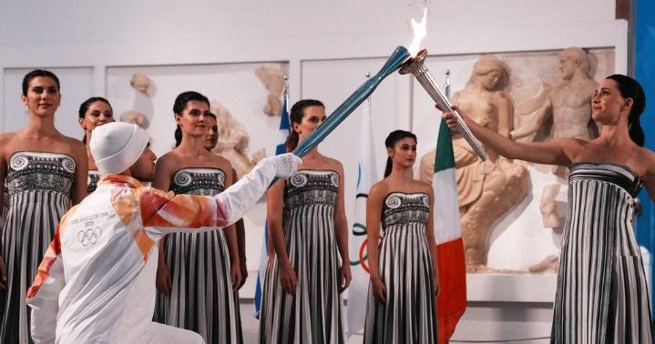 Under a cloud, the Olympic flame begins its journey to the Milan Cortina Winter Olympics