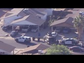 Woman hurt, crews working to contact suspect at Mesa home