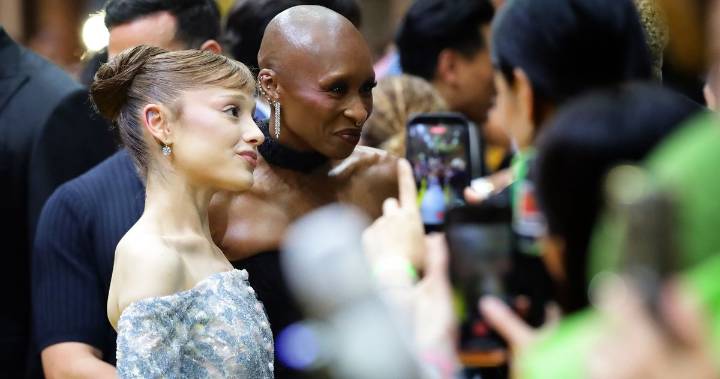 Cynthia Erivo Protects Ariana Grande From Fan in Singapore