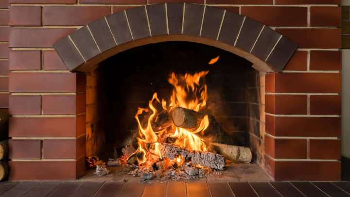 The Wood Burning Fireplace Trend Is Back - Here's How To Make It More Modern