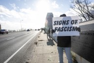 During Veterans Day protest, group takes tip from advertising for anti