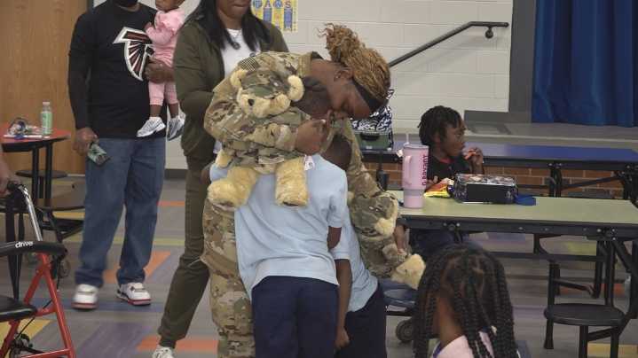 'I missed my babies' | Local army mom reunites with sons in heartwarming school lunch surprise