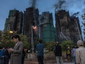 Hong Kong apartment death toll soars as city investigates fire cause