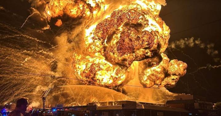 Pictures show 150 metre tall fireball explosion as hundreds of firefighters battle monster inferno