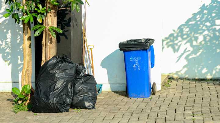 The Garage Upgrade That Hides The Eyesore Of Trash Cans