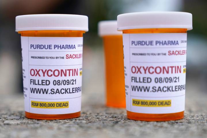 Judge approves opioid settlement for Purdue Pharma and Sackler family members who own the company