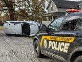 SUV flips in Warren Township neighborhood