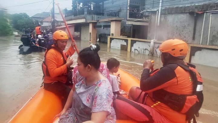 Bali floods: At least 20 people dead and six missing after flooding and landslides on holiday island