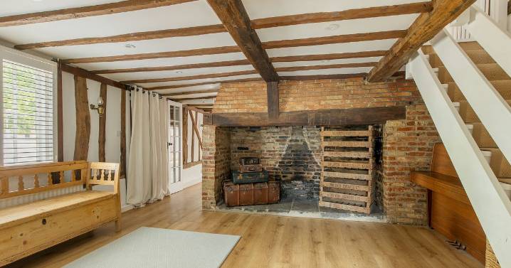 Thatched cottage oozing with 'historical charm' for sale in village with highly