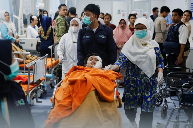 Blasts injure dozens at Indonesian mosque, student suspected