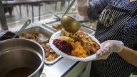 Thanksgiving Day meals served up by volunteer crew at Mercy Soup Kitchen in Wyandanch