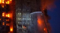 13 people killed in fire engulfing Hong Kong high-rise residential buildings, fire services say : NPR