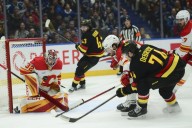 Deadspin | Flames score 5 consecutive goals to surge past Canucks