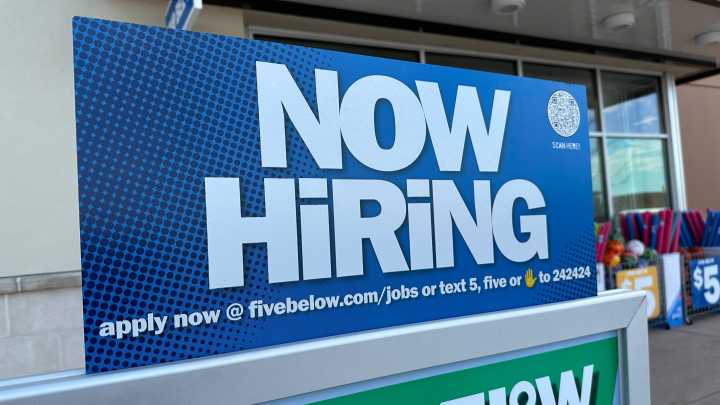 Fewer Americans sought unemployment benefits last week as layoffs remain low