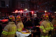 Dead woman found in Bronx apartment fire; nine firefighters and cops injured in blaze