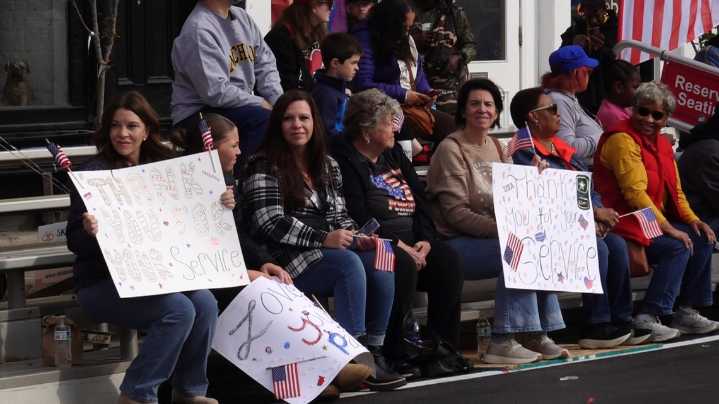 People line the streets of NuLu for Veterans Day Parade