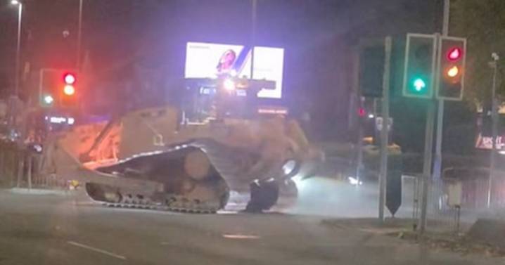 Moment bulldozer rampages through city centre in two-and-a