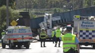 Sydney Trains worker dies after being trapped in cherry picker after crash into railway bridge in NSW central west