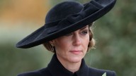 Solemn Kate Middleton looks windswept in fringed dress and largest hat of 2025