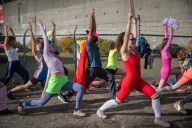 Neon-clad protesters stage ’80s aerobics demonstration outside Portland ICE facility