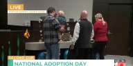 Child gets adopted for National Adoption Day